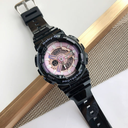 Casio Baby-G resin watch with black band and pink dial, angled view