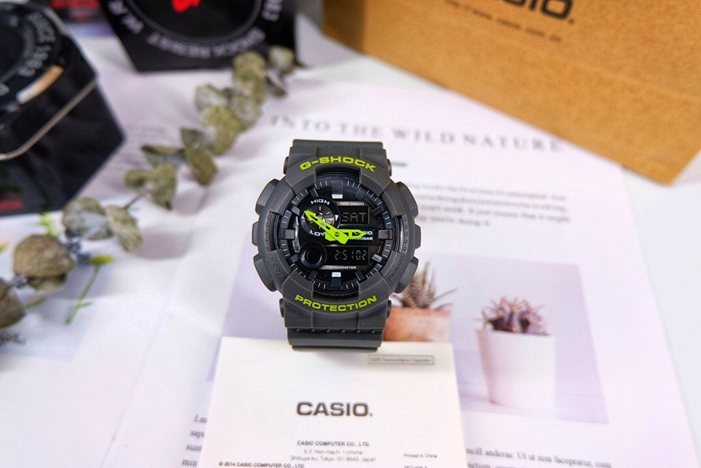 Casio G-Shock watch with black resin strap and green digital accents