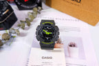 Casio G-Shock watch with black resin strap and green digital accents