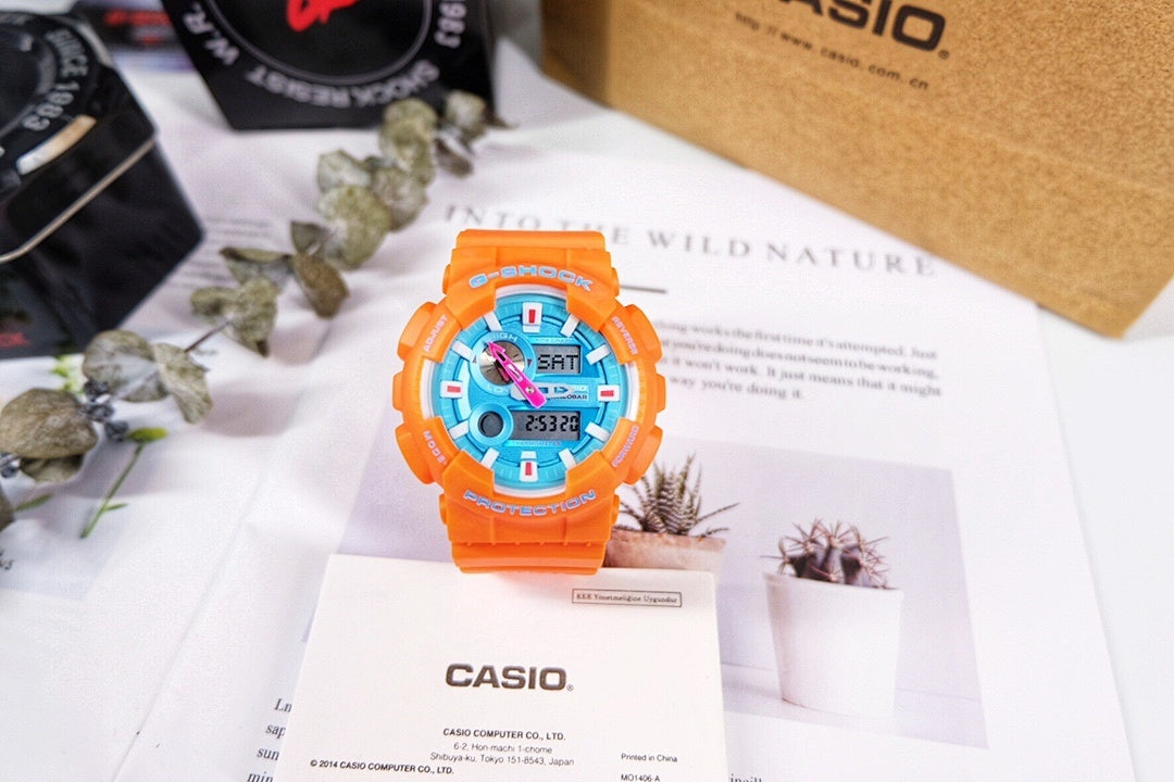Casio G-Shock watch with orange resin strap and blue digital face