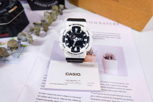 Casio G-Shock watch with white resin strap and black digital display