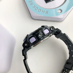 Casio watch front with black bezel and pink dial accents