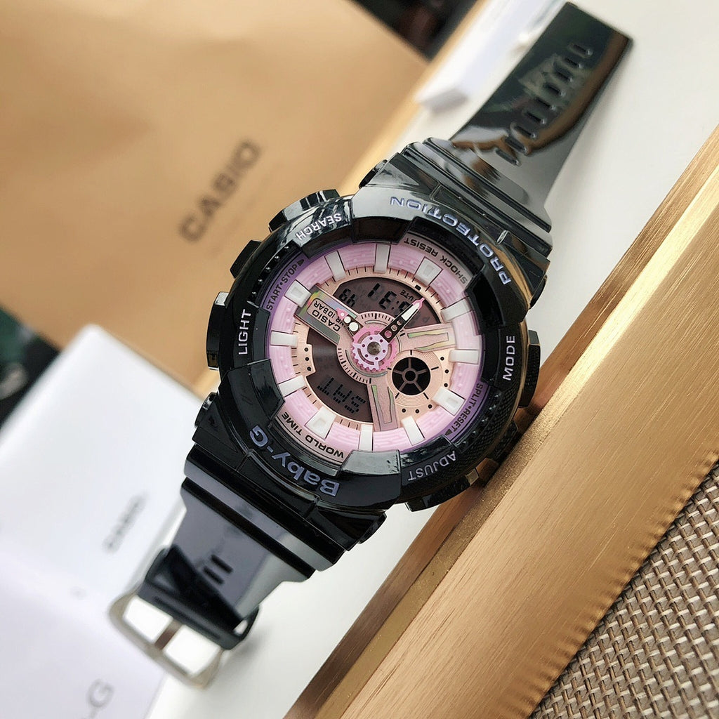 Casio watch with black strap and pink round dial with bezel markings