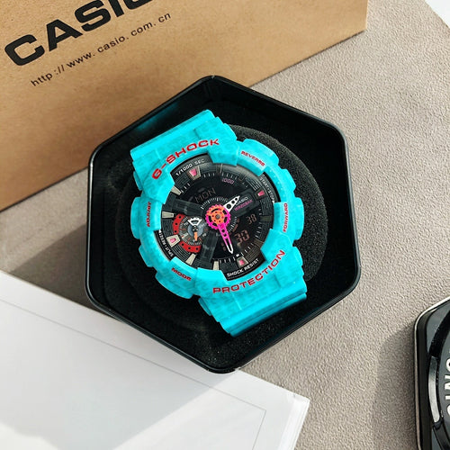 Casio G-Shock watch with black dial and bright cyan resin band in gift box
