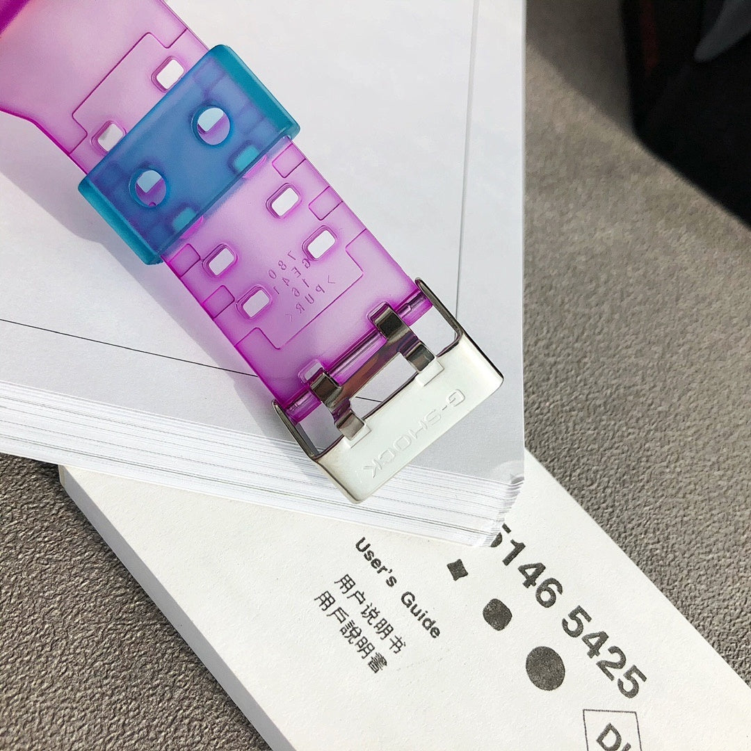 Casio G-Shock watch with translucent purple strap and aqua face detail on packaging card