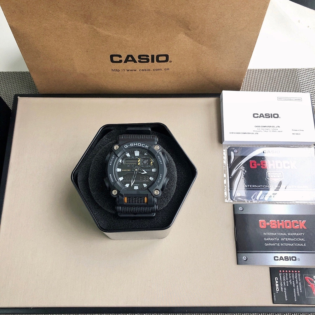 Black resin digital wristwatch in hex box with strap and round face
