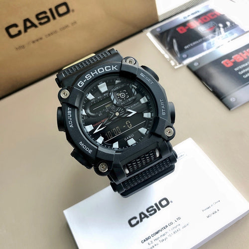 Black G-Shock watch with large round bezel, textured strap, and dark dial.