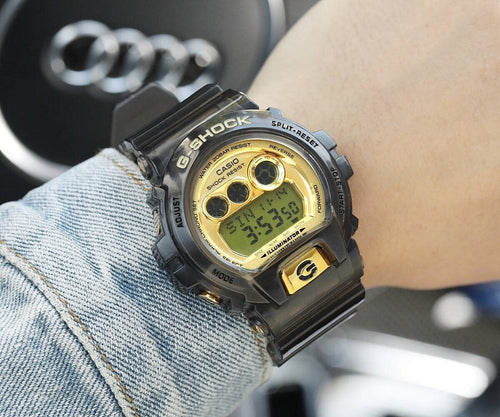 Casio G-Shock digital watch with gold-tone dial and black resin strap