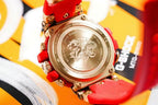 Casio G-Shock watch backplate on red strap, gold-tone hardware and coin-like case