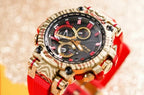 Casio G-Shock watch close-up, red strap and gold-tone bezel over black dial