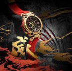 Casio G-Shock watch standing on dark textured surface, red strap and gold-tone case