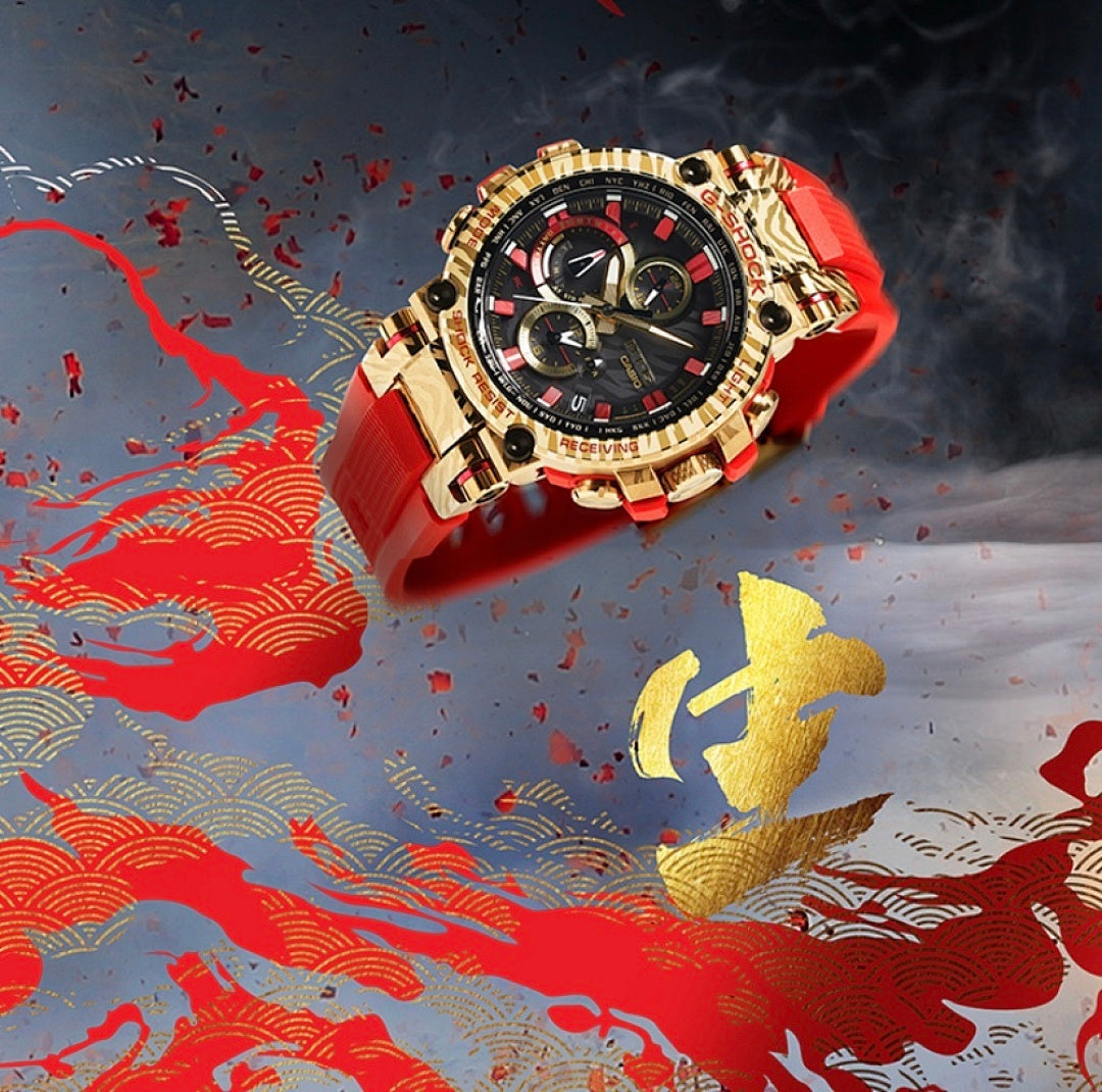 Casio G-Shock watch with red strap and gold-tone metal bezel, black multi-dial face