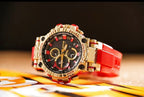 Casio G-Shock watch angled view, red strap with gold-tone case and black dial