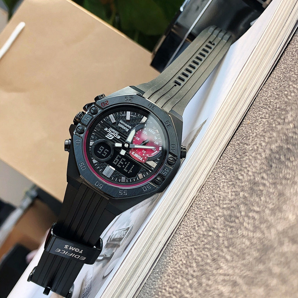 Casio Edifice wristwatch with black resin strap and dark dial, angled view