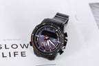 Casio watch angled view with black bracelet, blue dial, red bezel markings and sub-dials