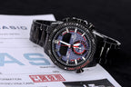 Casio watch on documents with black metal strap, blue dial and red-ring sub-dial