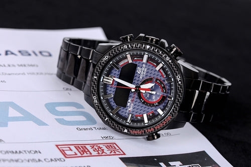 Casio watch with black metal link strap, round bezel, blue dial with red sub-dials