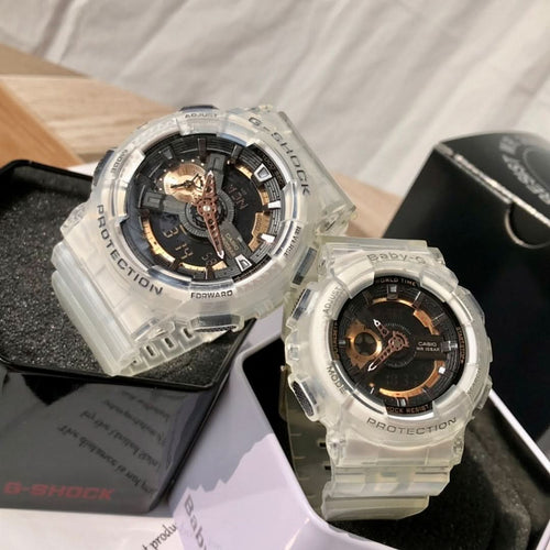 Casio G-Shock watch with clear case, black dial, gold-tone hands, clear strap