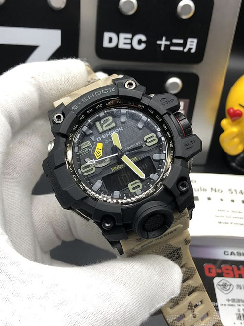 Casio G-Shock watch with black bezel, round face, and light camo strap