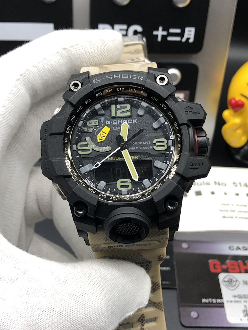 Casio G-Shock watch close-up with black bezel, green markers, and camo strap