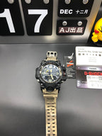 Casio G-Shock watch standing with black case and light camo strap
