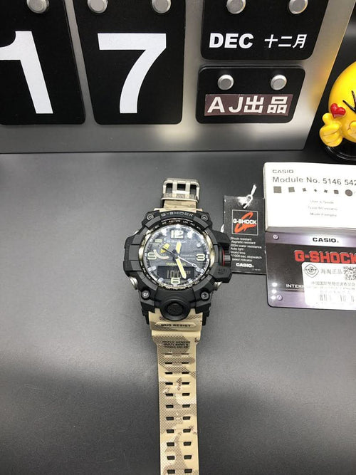 Casio G-Shock watch standing with black case and light camo strap