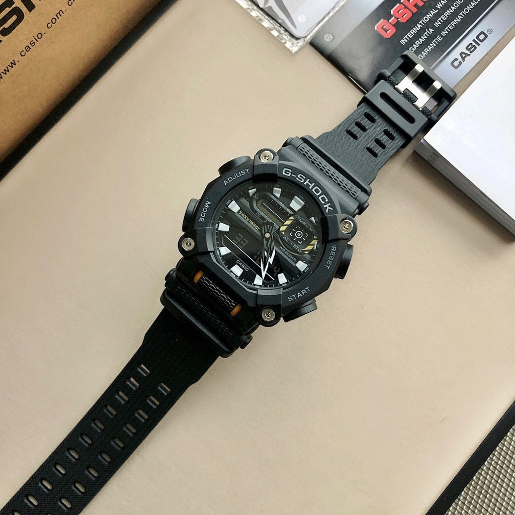 Casio G-Shock watch with black strap and orange accents near the case