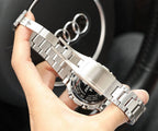Silver-tone metal watch bracelet and case close-up