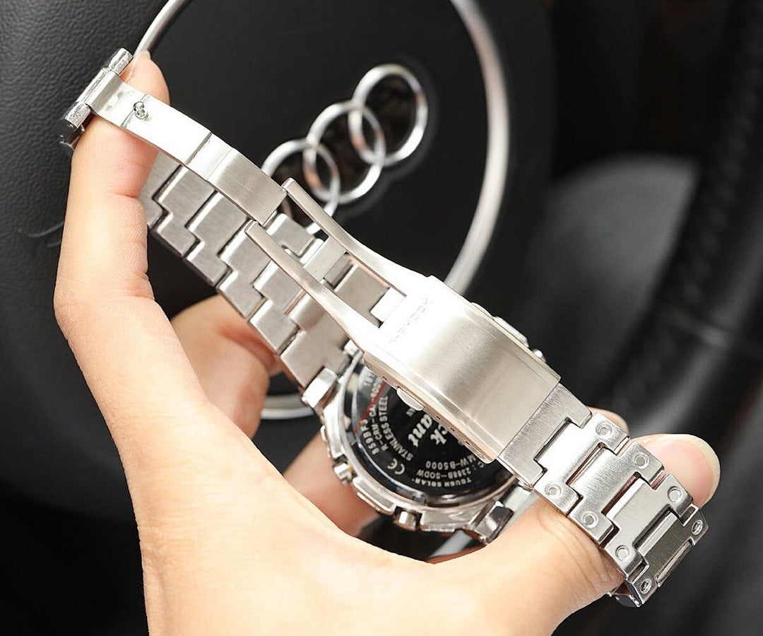 Silver-tone metal watch bracelet and case close-up