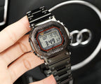Black metal digital G-Shock watch with LCD display