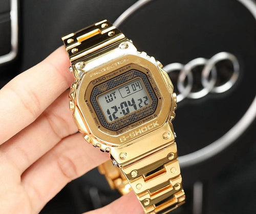 Gold-tone metal digital watch with rectangular LCD display