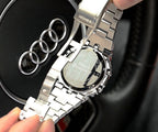 Silver-tone metal wristwatch with textured case detail