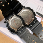 Casio watch casebacks with metal backs and black strap links, screws visible.