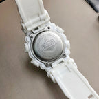Casio G-Shock watch caseback with embossed text and a white resin strap
