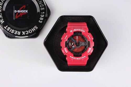 Red G-Shock wristwatch with black dial, shown in a hex display box