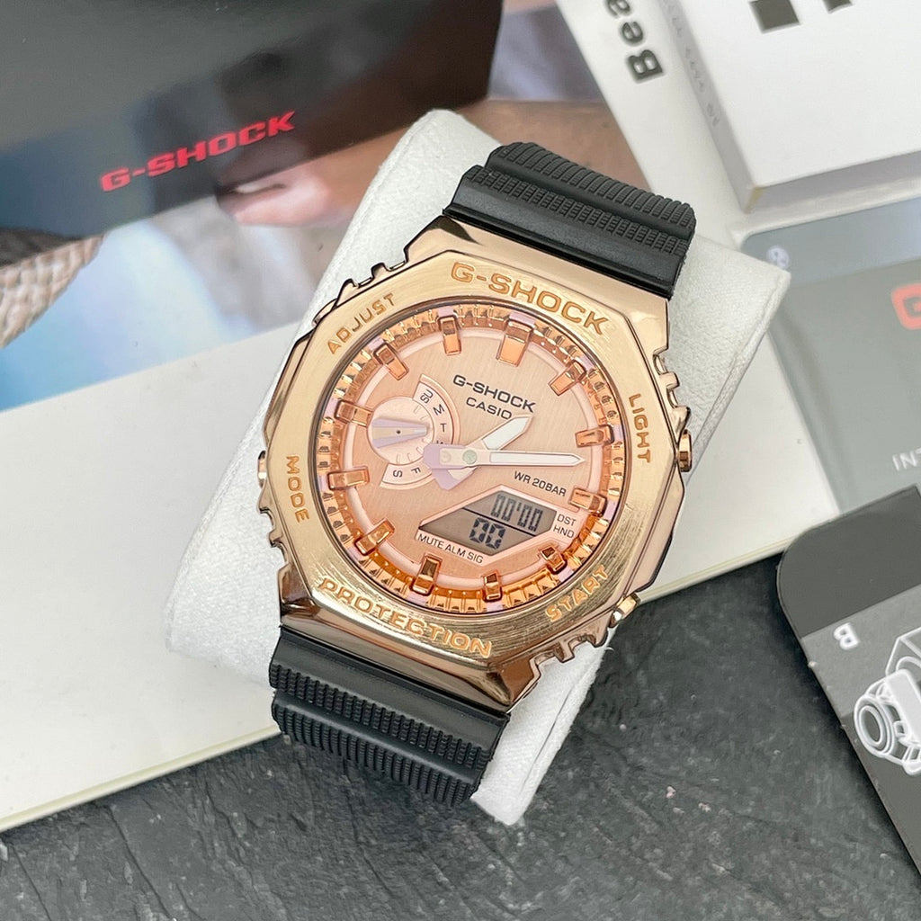 Casio G-Shock analog watch with rose-gold face and black resin strap