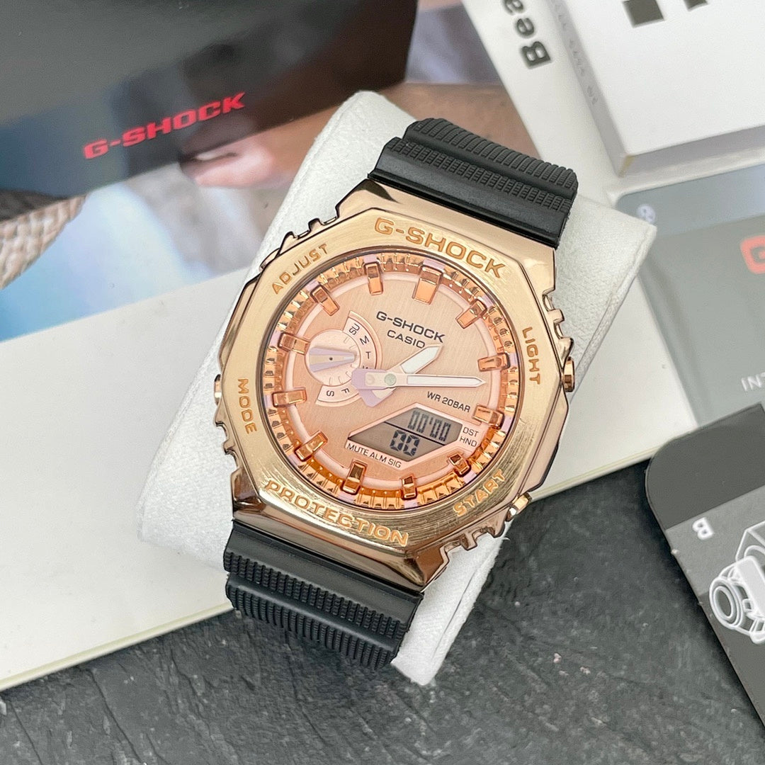 Casio G-Shock analog watch with rose-gold face and black resin strap