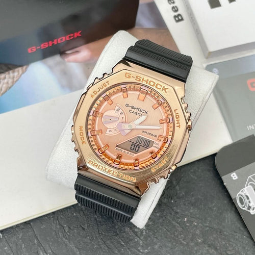 Casio G-Shock analog watch with rose-gold face and black resin strap