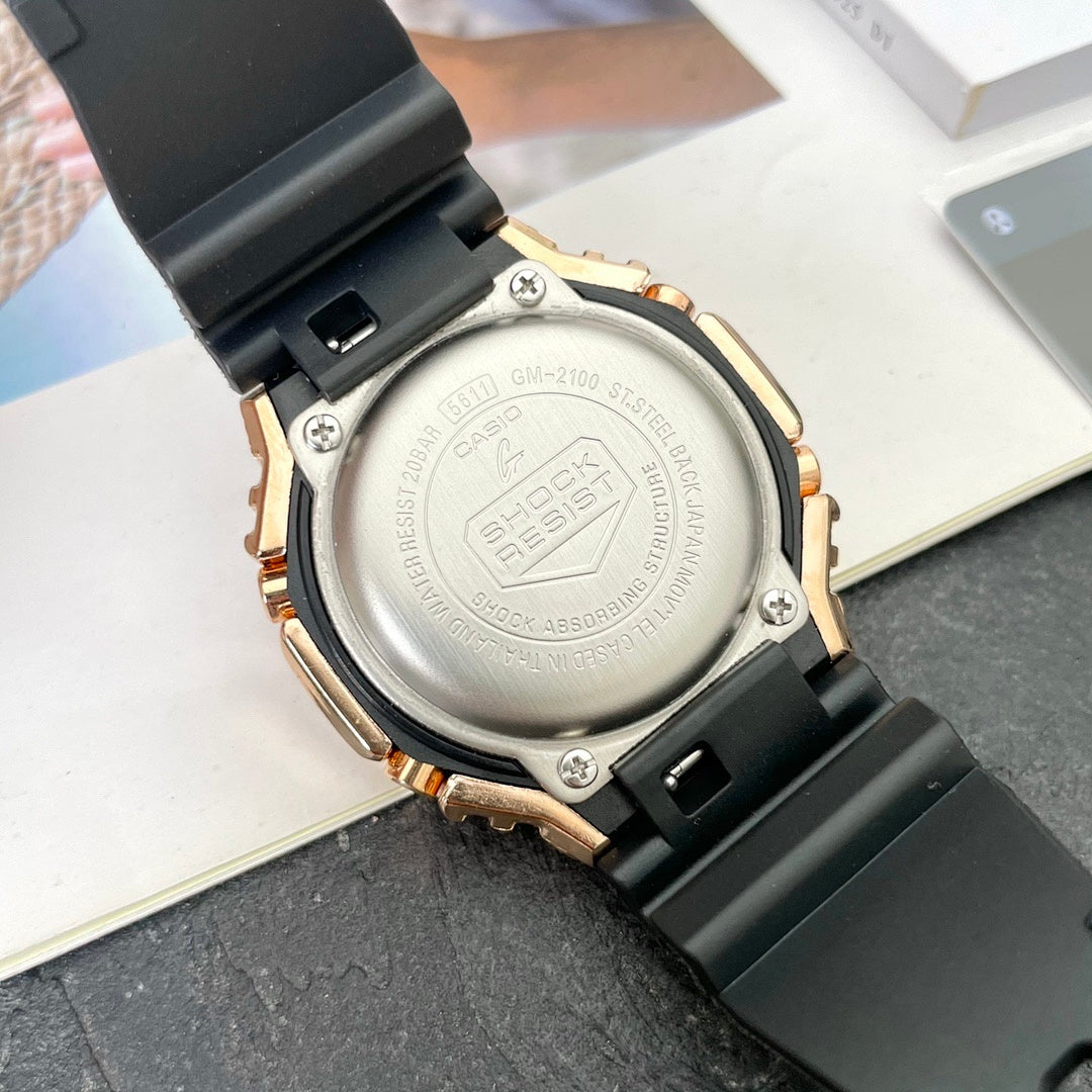 Casio G-Shock watch caseback in silver with rose-gold edges and black strap