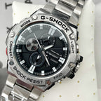 Casio G-Shock wristwatch close-up, black dial with Tough Solar text and metal bezel