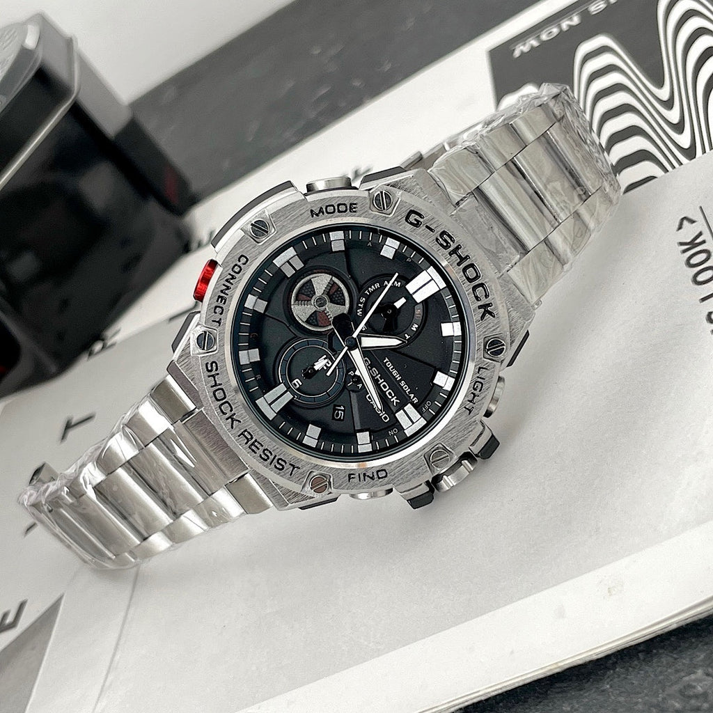 Casio G-Shock wristwatch with steel bracelet and red accent on the crown