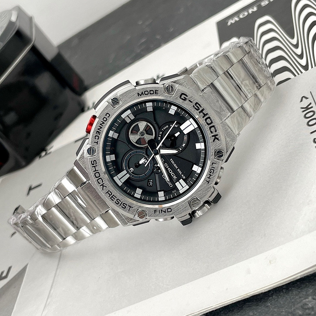 Casio G-Shock wristwatch with steel bracelet and red accent on the crown