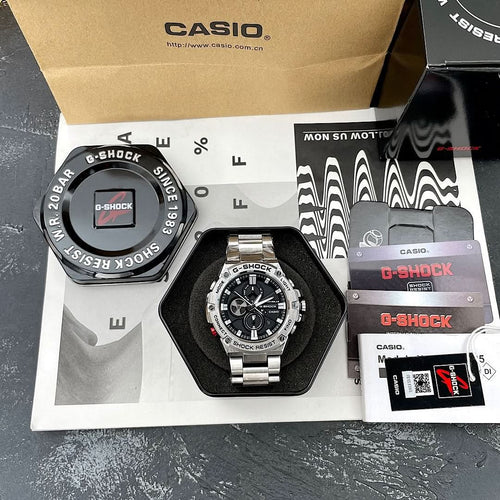 Casio G-Shock wristwatch in retail box set, steel bracelet and black dial