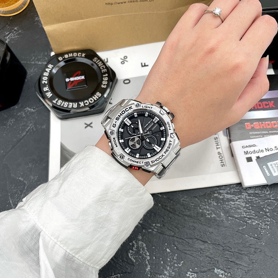 Casio G-Shock wristwatch on wrist, stainless steel case with black dial and subdials
