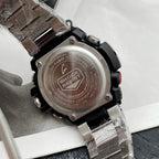 Casio G-Shock wristwatch case back close-up, stainless steel and black rubber strap