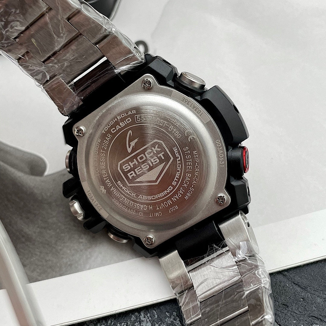 Casio G-Shock wristwatch case back close-up, stainless steel and black rubber strap