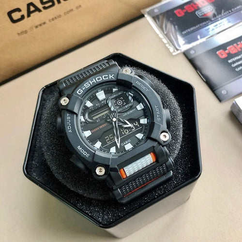G-Shock wristwatch with black case and orange-accent dial, in a black box