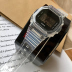 Casio watch with clear resin band and black digital face, angled view