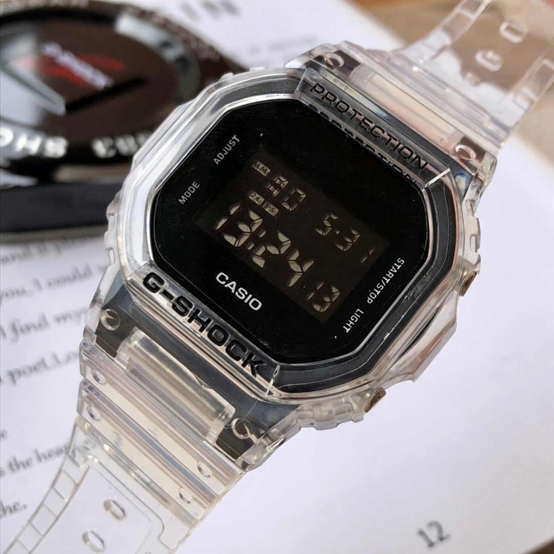 Casio watch close-up, clear resin strap and black LCD display with digits
