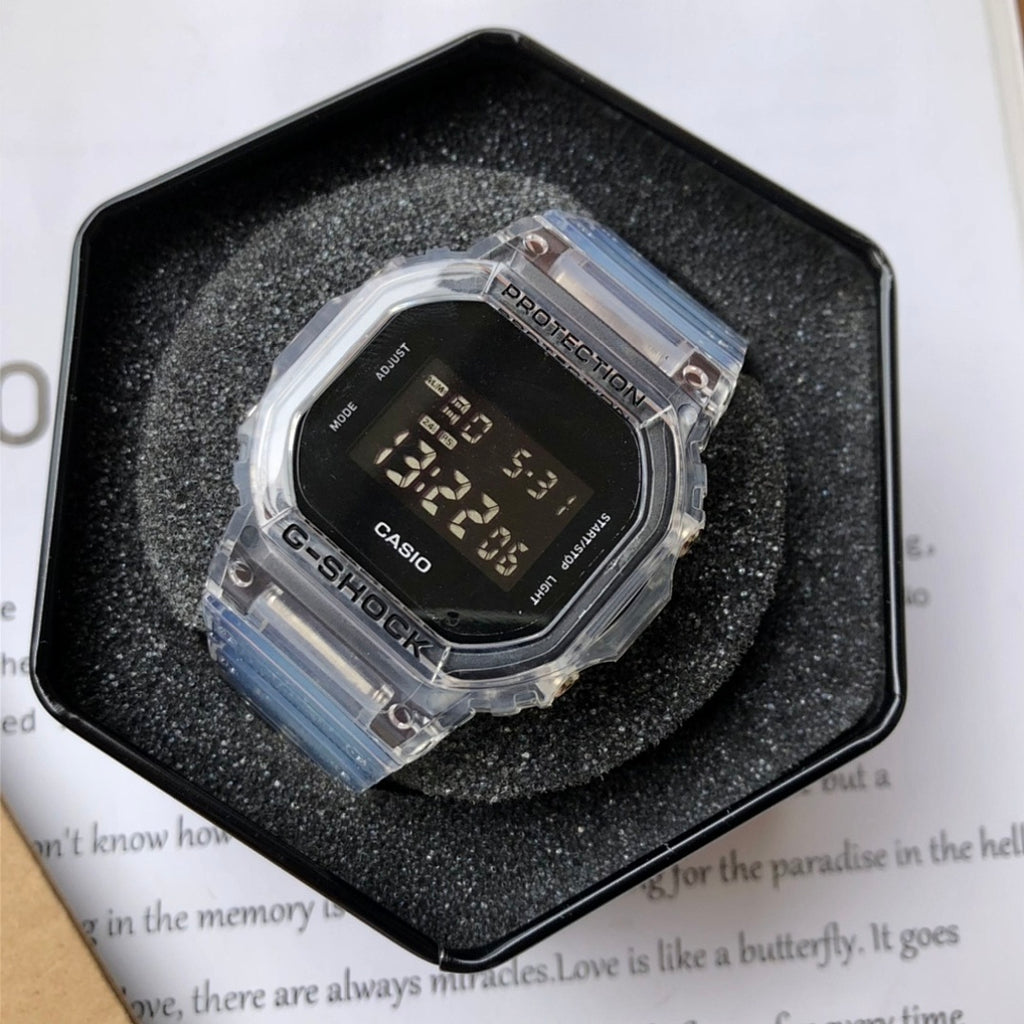 Casio watch with clear resin strap and black digital face in protective case